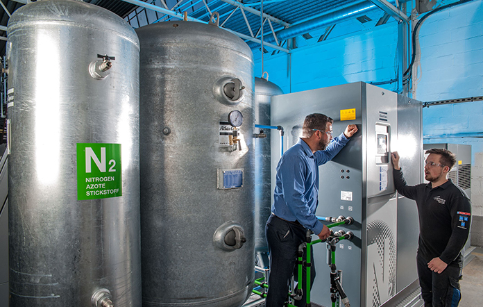 on-site nitrogen generator next to men working